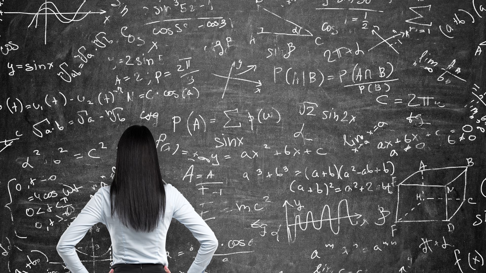 Girl in front of board with mathy equations